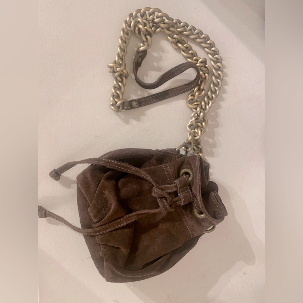 Suede brown crunch crossbody. Strap is long and comes to hip. Great condition